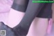 A close up of a woman's legs in black stockings.