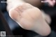 A close up of a person's foot with a pair of white socks.