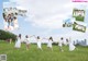 A group of young women holding hands in a field.