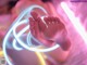 A close up of a person's feet in a neon light.